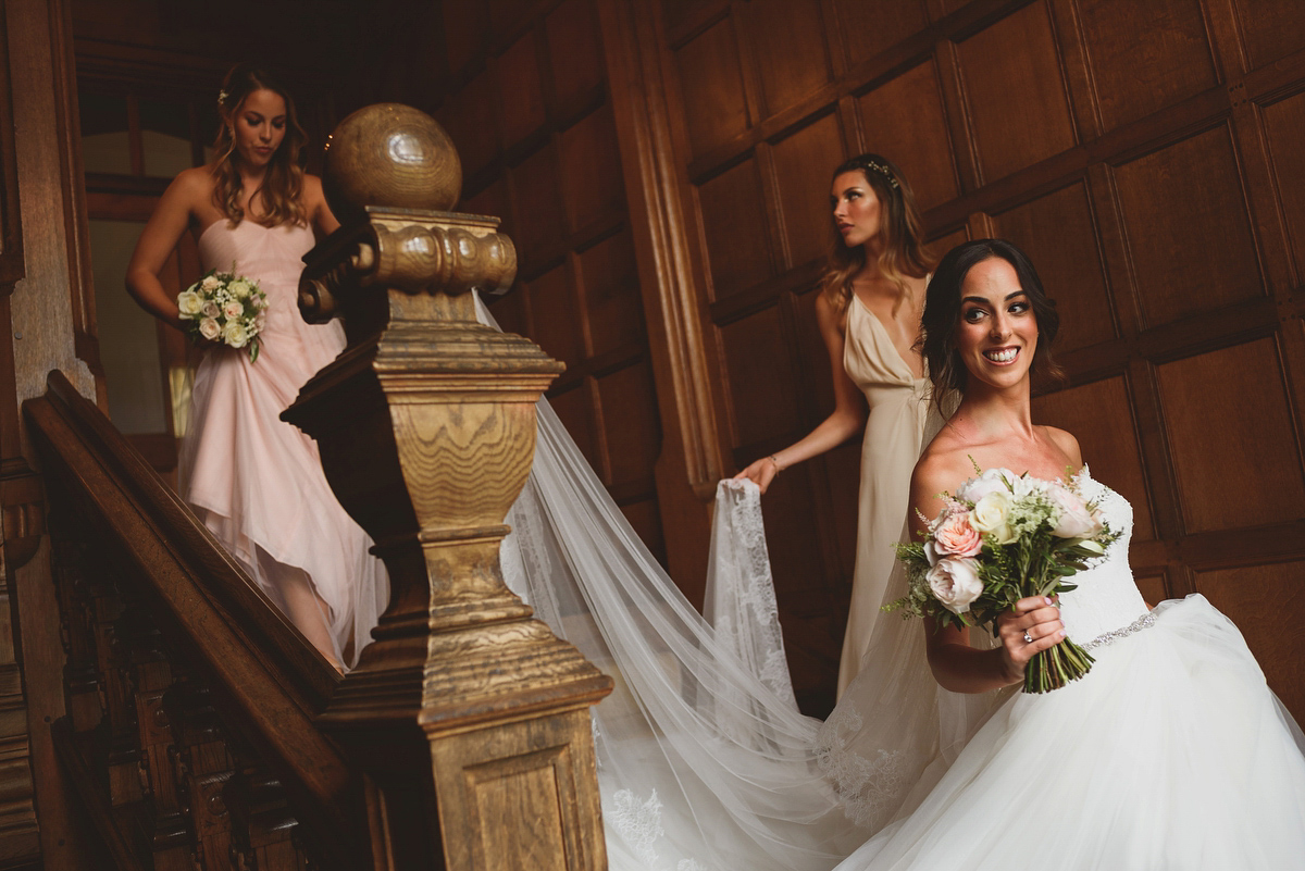 Sarah wore Rosa Clara for her classy and elegant black tie wedding at Hengrave Hall. Photography by Jackson & Co.