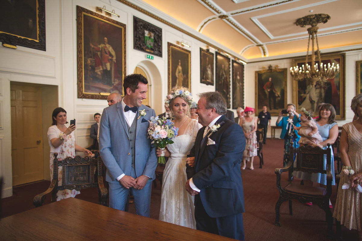 Rebecca wore a Charlie Brear gown from the Cicily Bridal boutique for her vintage tea party, village hall wedding. Captured by Ragdoll Photography.