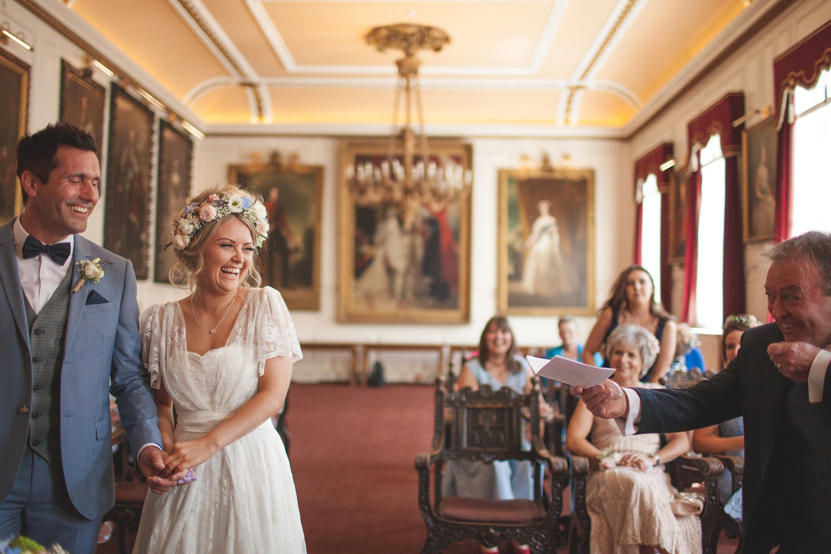 Rebecca wore a Charlie Brear gown from the Cicily Bridal boutique for her vintage tea party, village hall wedding. Captured by Ragdoll Photography.