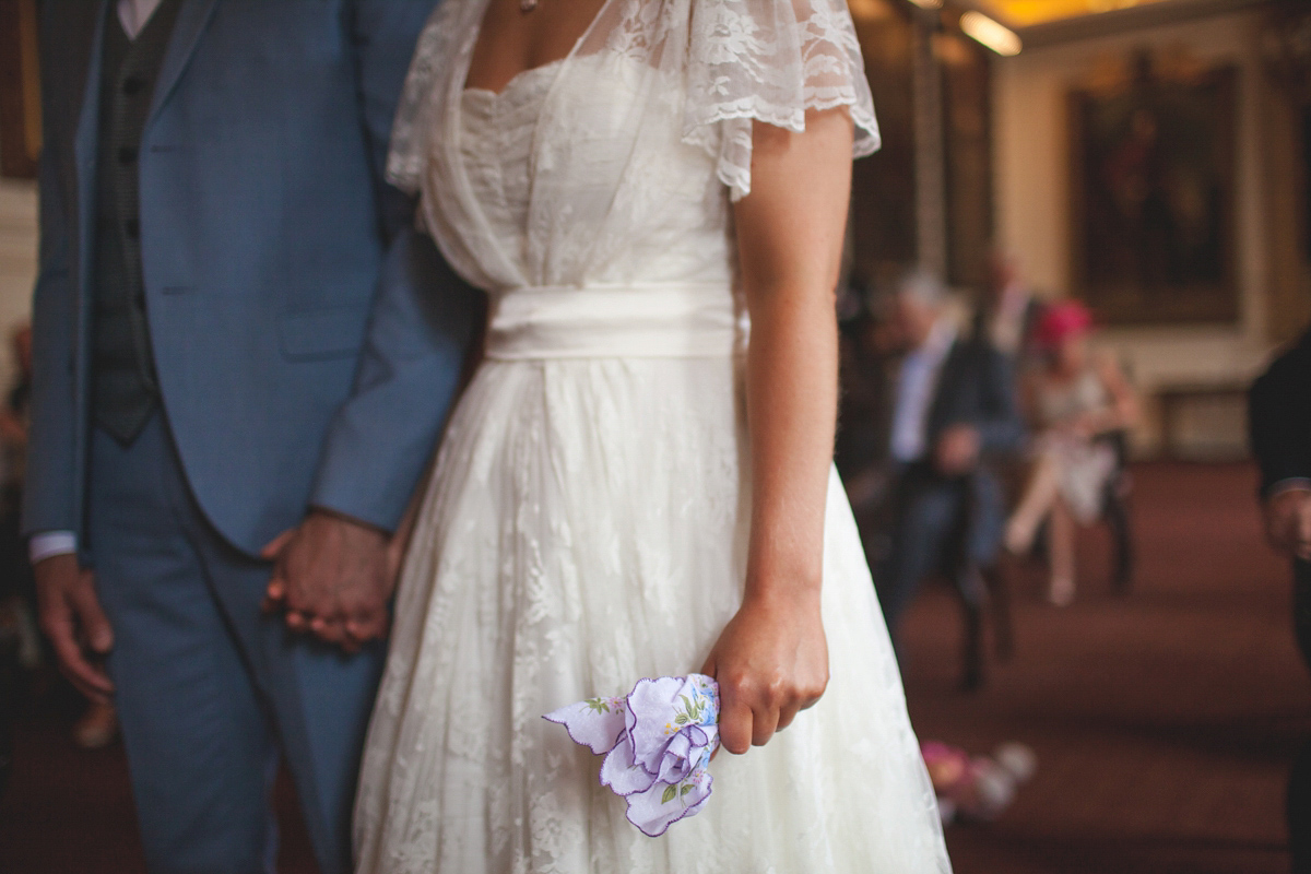 Rebecca wore a Charlie Brear gown from the Cicily Bridal boutique for her vintage tea party, village hall wedding. Captured by Ragdoll Photography.