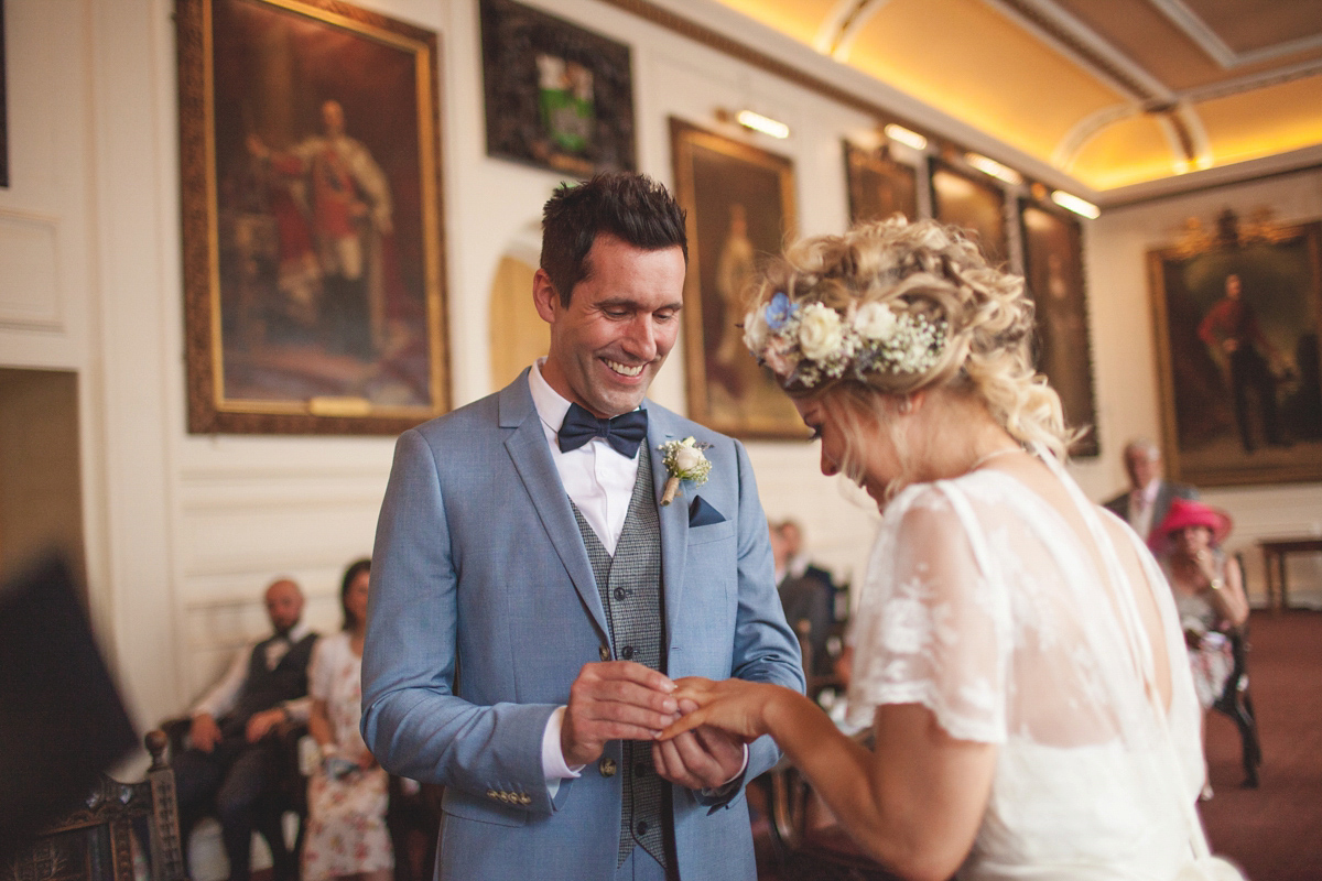 Rebecca wore a Charlie Brear gown from the Cicily Bridal boutique for her vintage tea party, village hall wedding. Captured by Ragdoll Photography.