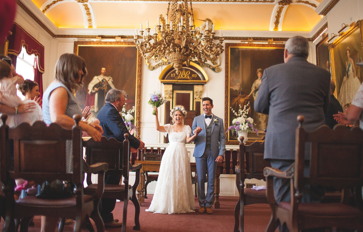 Rebecca wore a Charlie Brear gown from the Cicily Bridal boutique for her vintage tea party, village hall wedding. Captured by Ragdoll Photography.