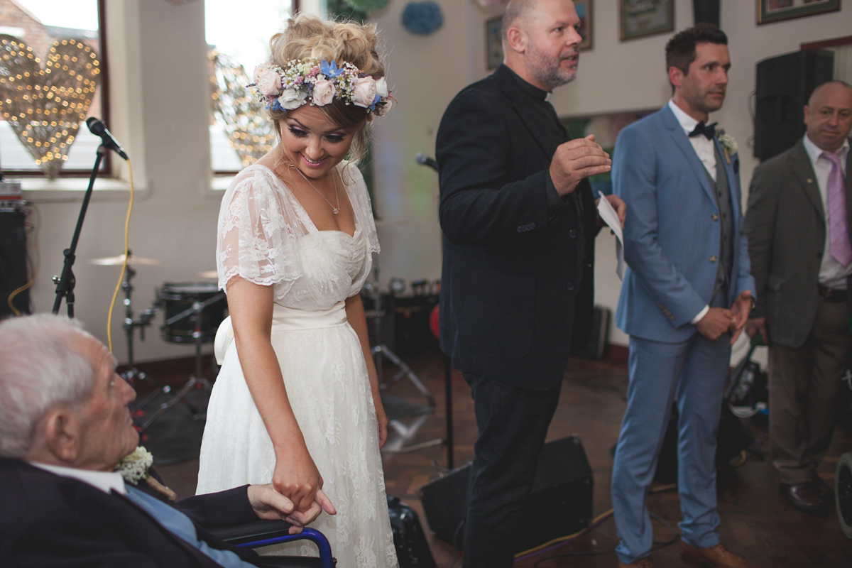 Rebecca wore a Charlie Brear gown from the Cicily Bridal boutique for her vintage tea party, village hall wedding. Captured by Ragdoll Photography.