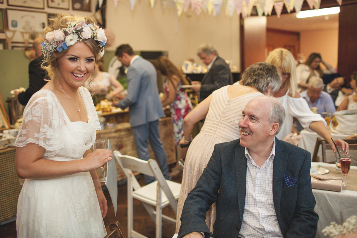 Rebecca wore a Charlie Brear gown from the Cicily Bridal boutique for her vintage tea party, village hall wedding. Captured by Ragdoll Photography.