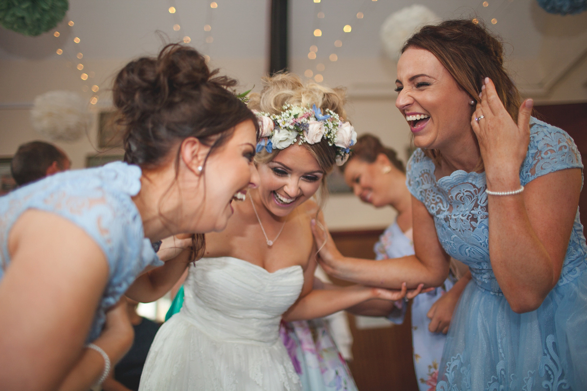 Rebecca wore a Charlie Brear gown from the Cicily Bridal boutique for her vintage tea party, village hall wedding. Captured by Ragdoll Photography.