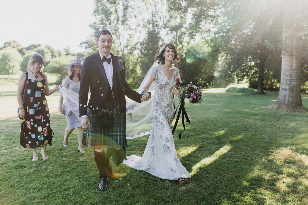 Bride Imogen wore the 'Jayne' gown by Eliza Jane Howell, and a Juliet cap veil, for her Celtic handfasting wedding at a French cheateau. Photography by Lifestories Wedding Photography.