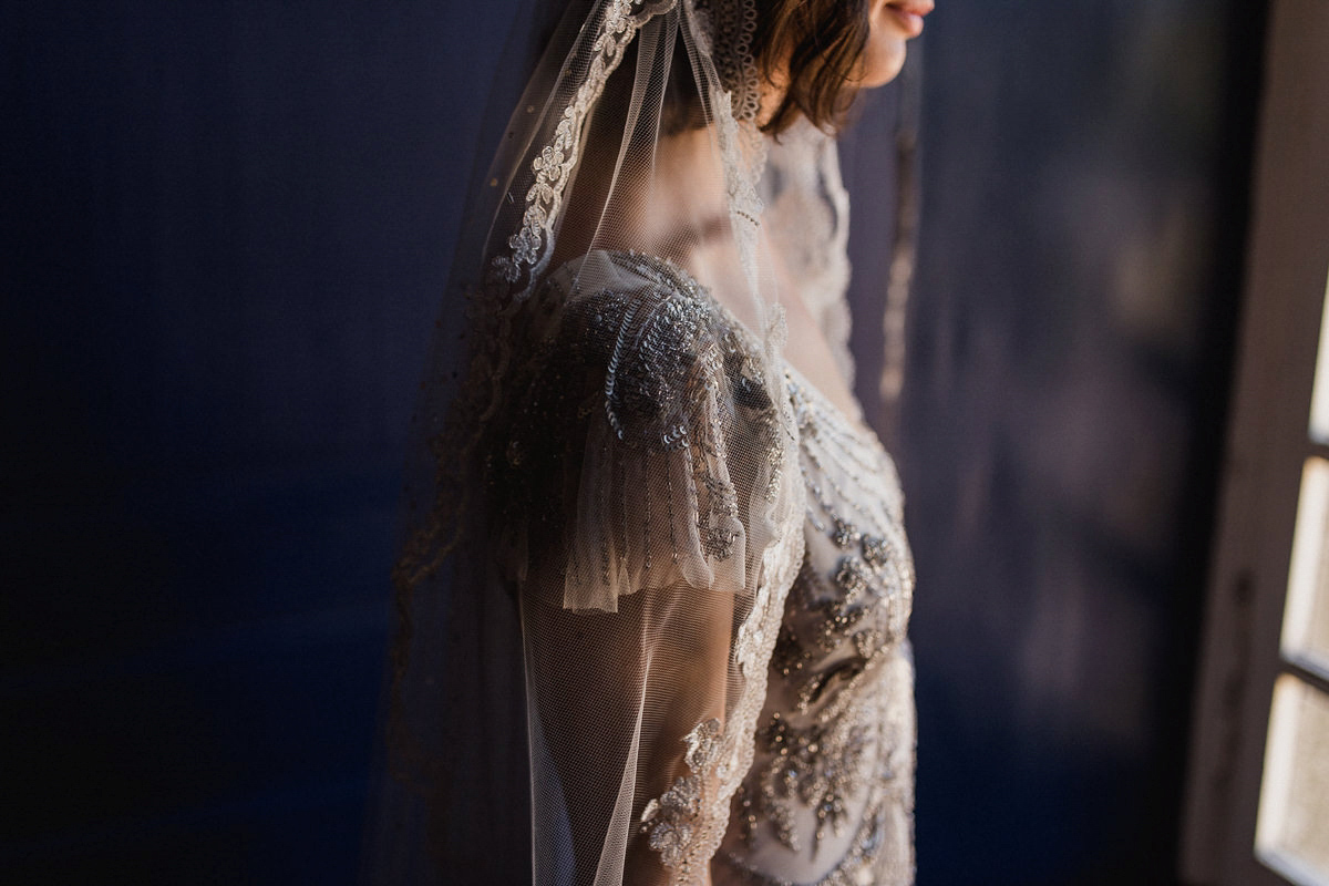 Bride Imogen wore the 'Jayne' gown by Eliza Jane Howell, and a Juliet cap veil, for her Celtic handfasting wedding at a French cheateau. Photography by Lifestories Wedding Photography.