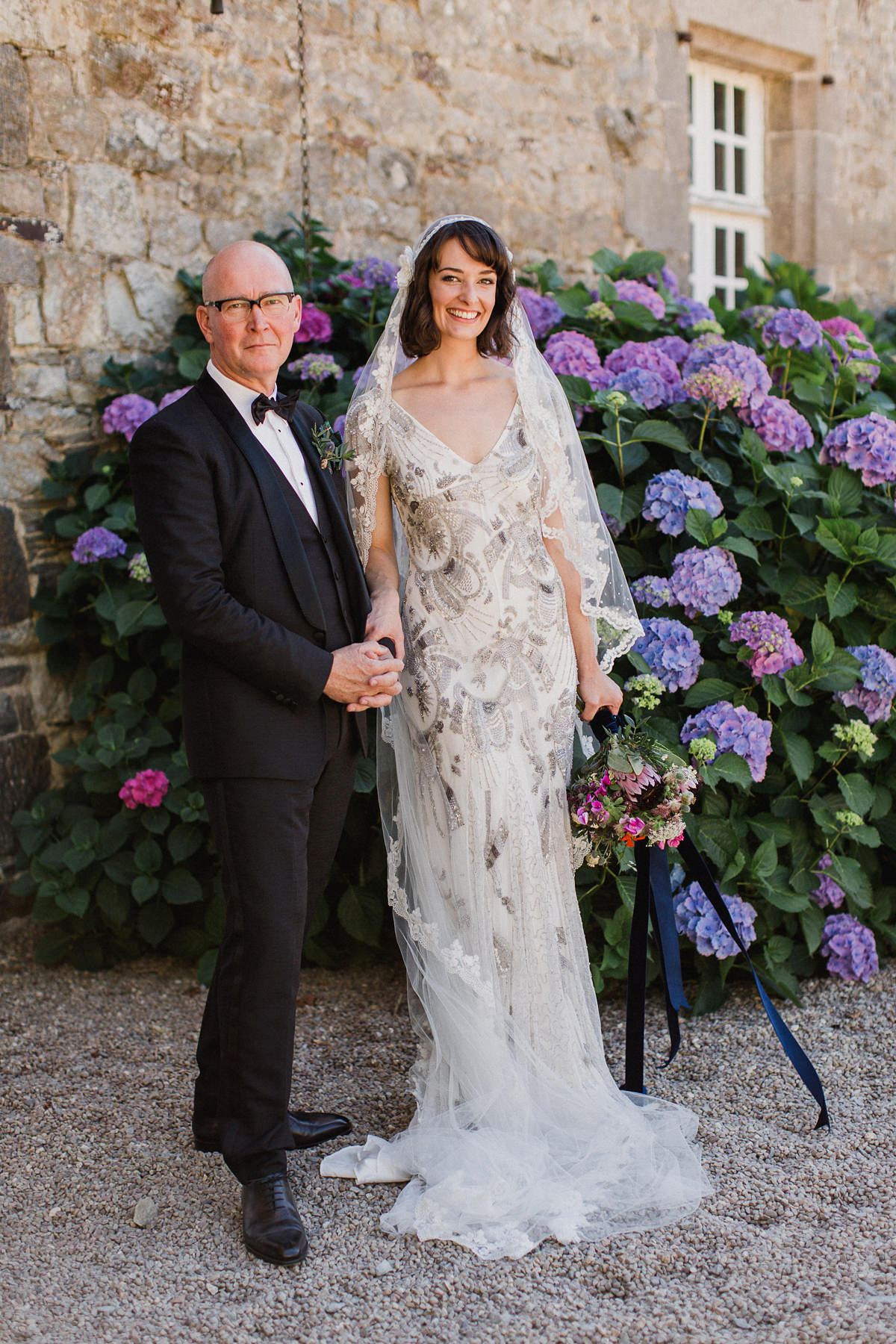 Bride Imogen wore the 'Jayne' gown by Eliza Jane Howell, and a Juliet cap veil, for her Celtic handfasting wedding at a French cheateau. Photography by Lifestories Wedding Photography.