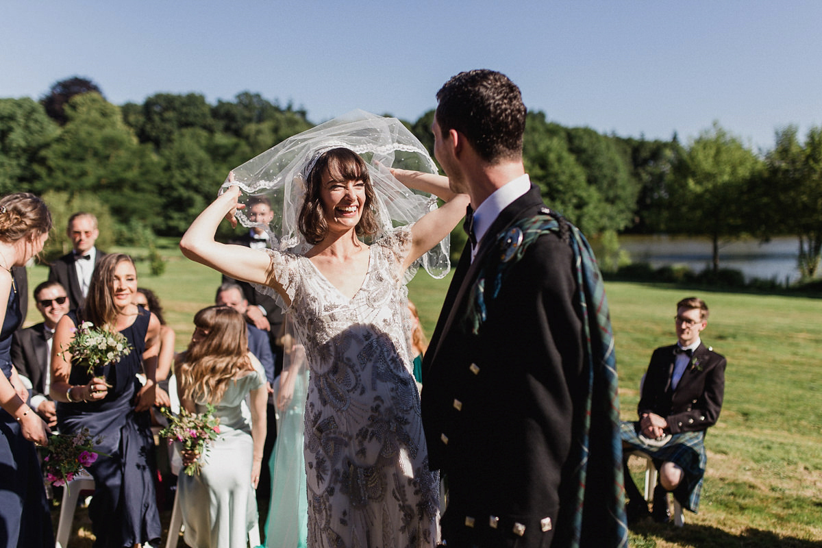 Bride Imogen wore the 'Jayne' gown by Eliza Jane Howell, and a Juliet cap veil, for her Celtic handfasting wedding at a French cheateau. Photography by Lifestories Wedding Photography.