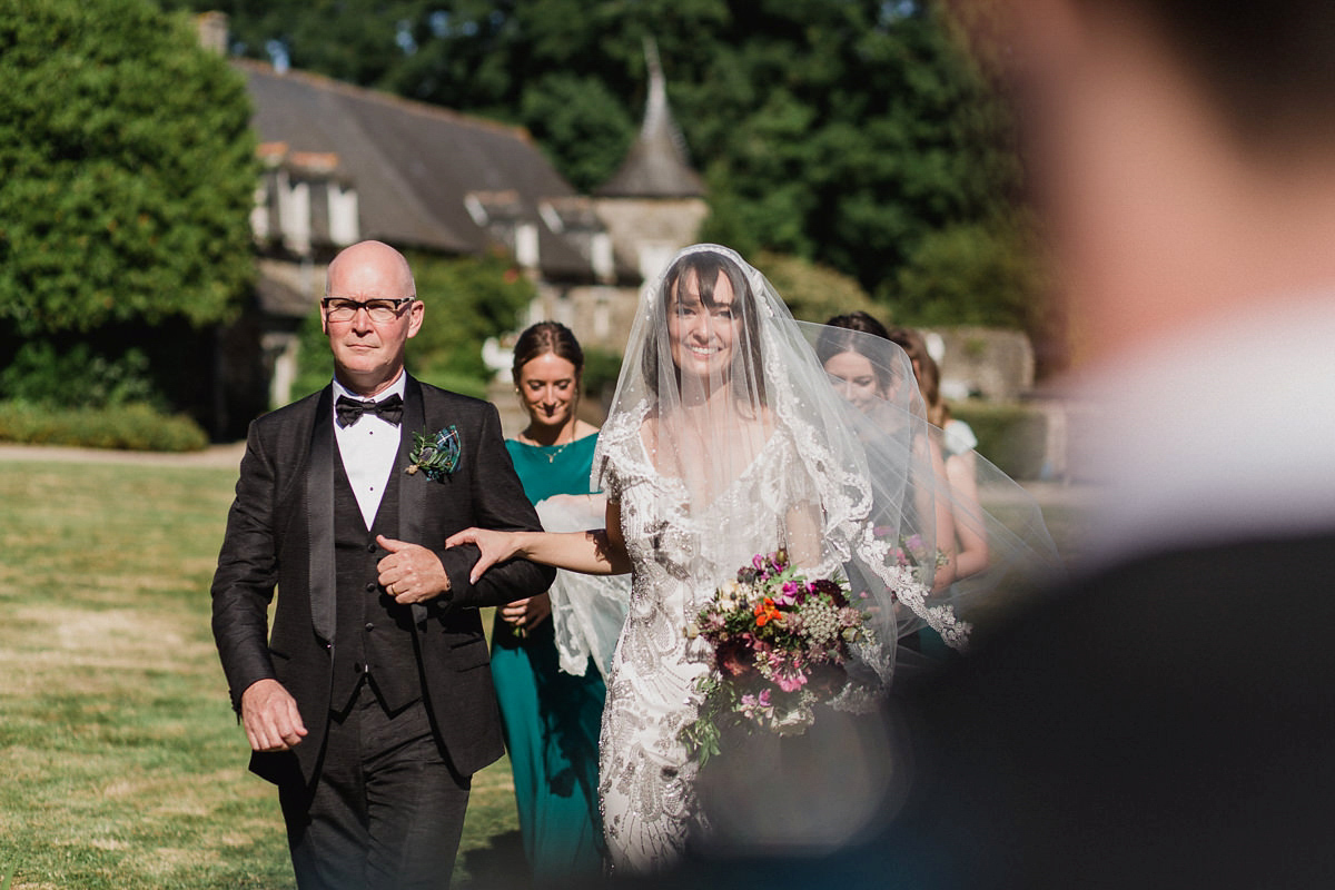 Bride Imogen wore the 'Jayne' gown by Eliza Jane Howell, and a Juliet cap veil, for her Celtic handfasting wedding at a French cheateau. Photography by Lifestories Wedding Photography.