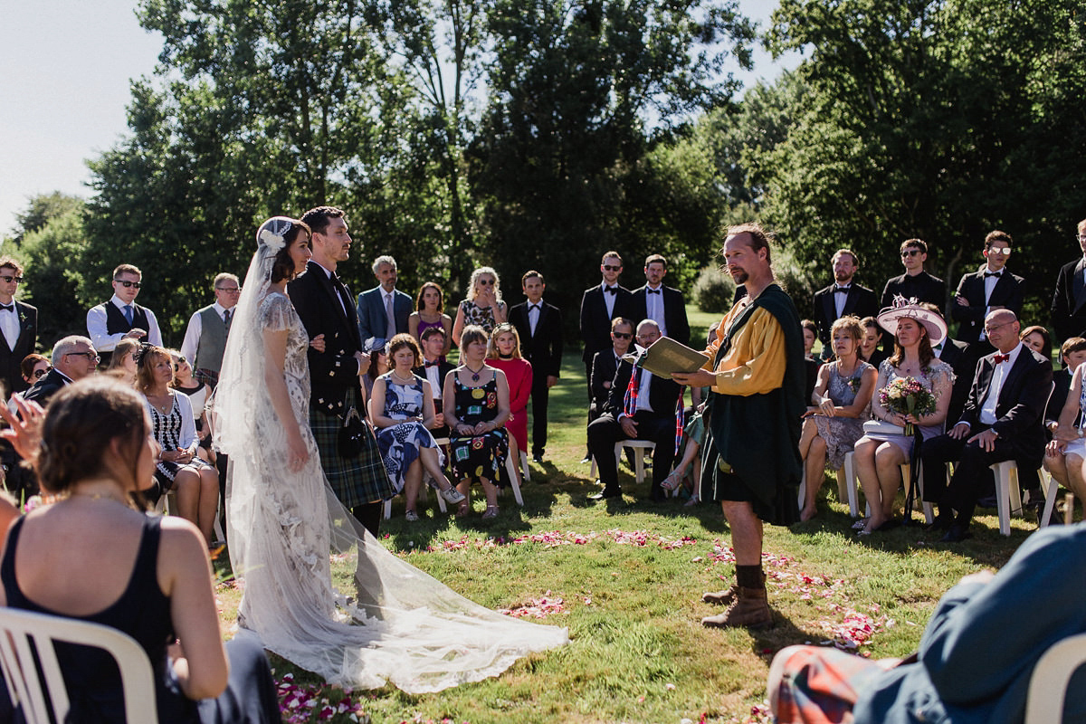 Bride Imogen wore the 'Jayne' gown by Eliza Jane Howell, and a Juliet cap veil, for her Celtic handfasting wedding at a French cheateau. Photography by Lifestories Wedding Photography.