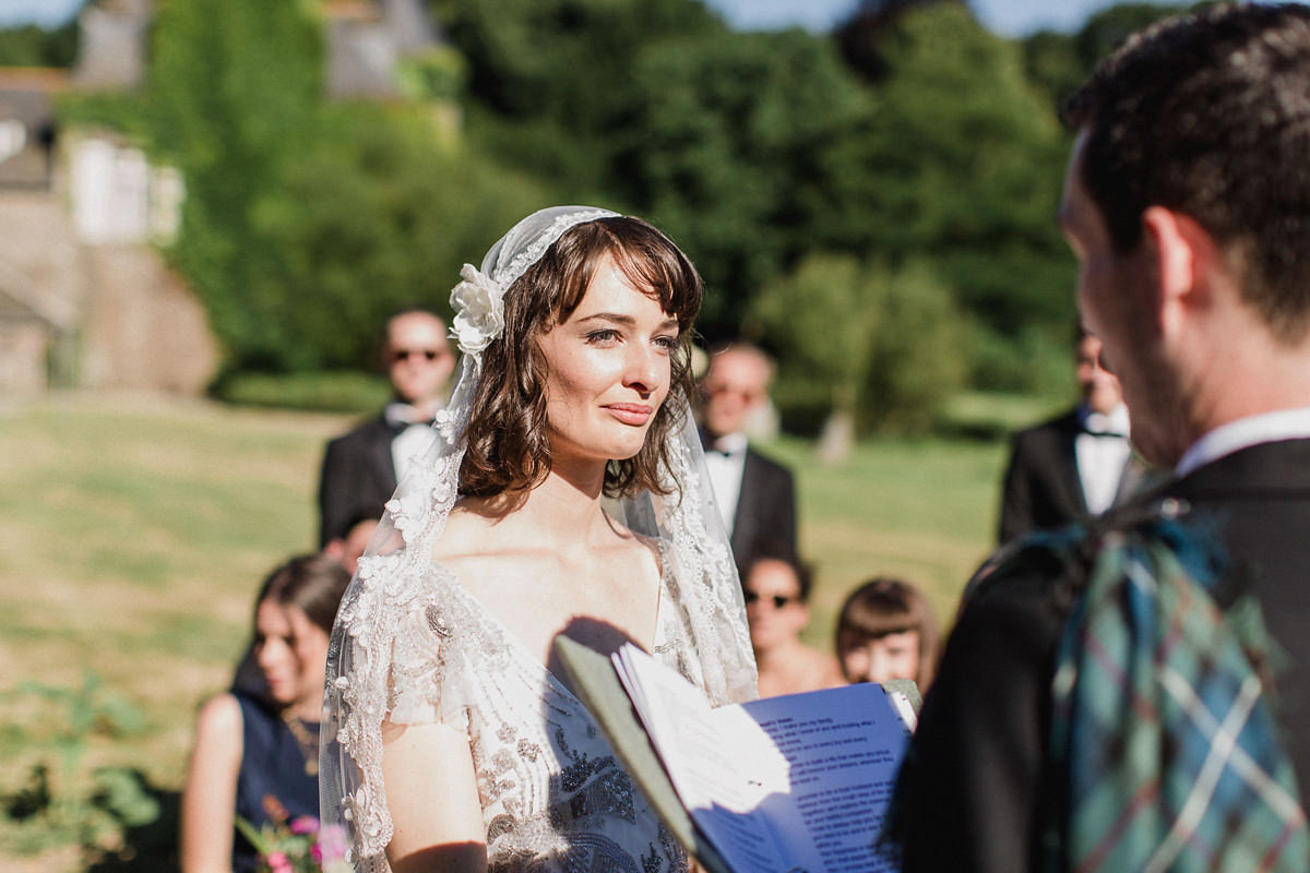 Bride Imogen wore the 'Jayne' gown by Eliza Jane Howell, and a Juliet cap veil, for her Celtic handfasting wedding at a French cheateau. Photography by Lifestories Wedding Photography.