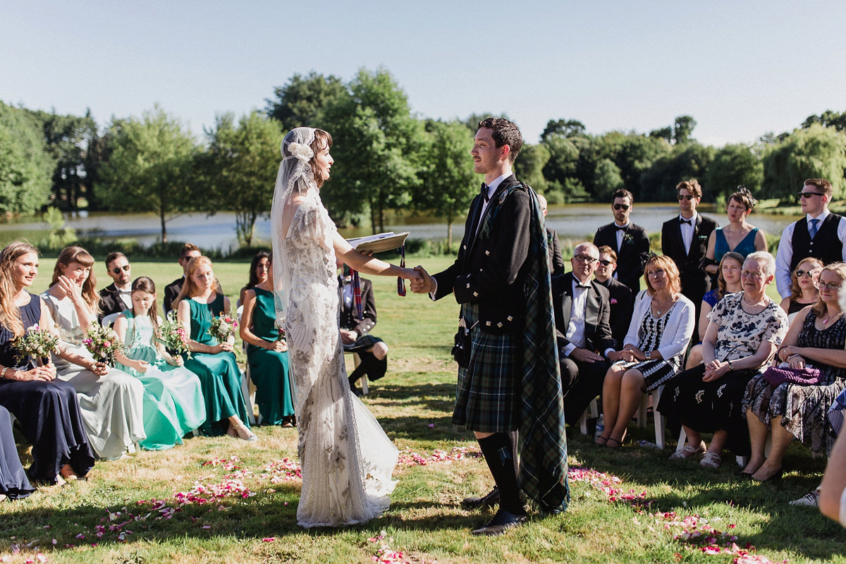 Bride Imogen wore the 'Jayne' gown by Eliza Jane Howell, and a Juliet cap veil, for her Celtic handfasting wedding at a French cheateau. Photography by Lifestories Wedding Photography.