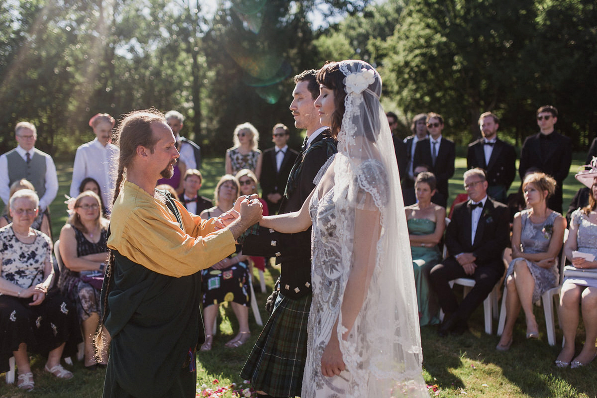 Bride Imogen wore the 'Jayne' gown by Eliza Jane Howell, and a Juliet cap veil, for her Celtic handfasting wedding at a French cheateau. Photography by Lifestories Wedding Photography.