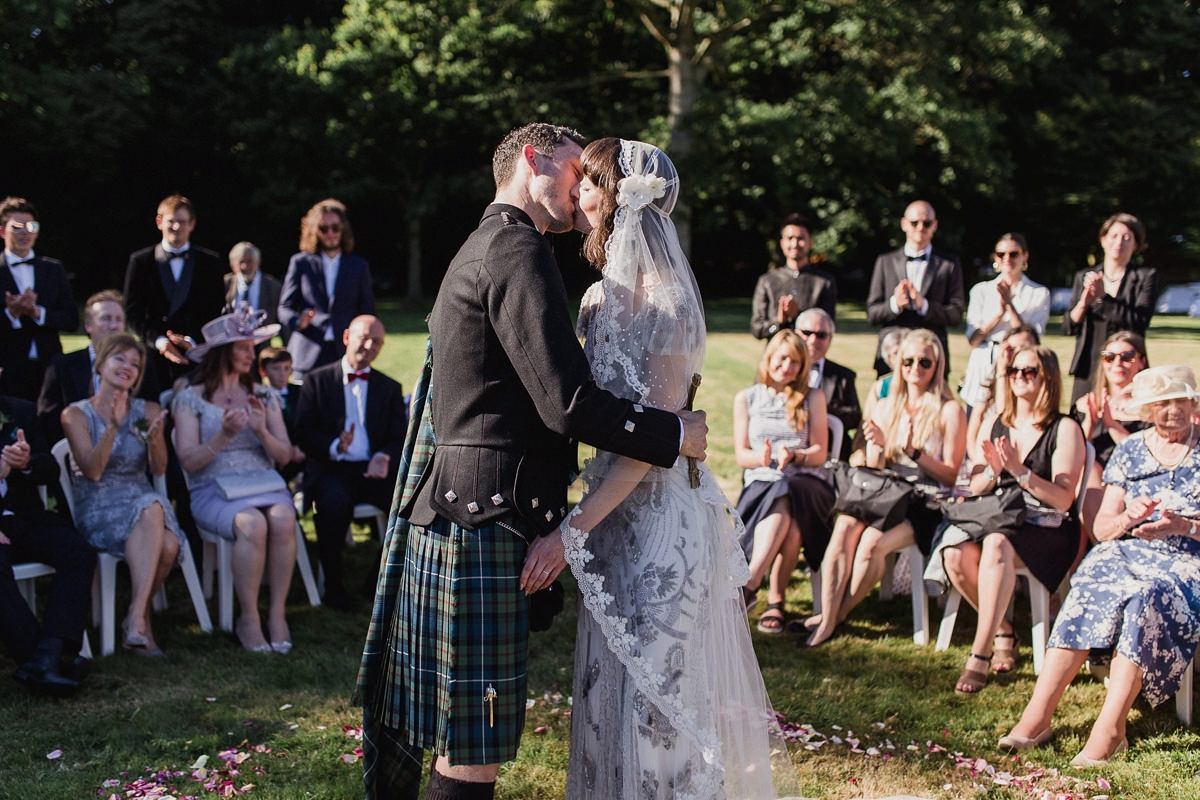 Bride Imogen wore the 'Jayne' gown by Eliza Jane Howell, and a Juliet cap veil, for her Celtic handfasting wedding at a French cheateau. Photography by Lifestories Wedding Photography.