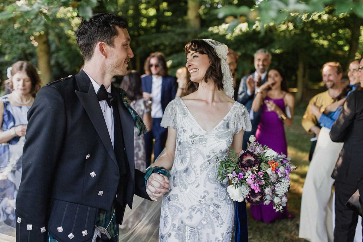 Bride Imogen wore the 'Jayne' gown by Eliza Jane Howell, and a Juliet cap veil, for her Celtic handfasting wedding at a French cheateau. Photography by Lifestories Wedding Photography.