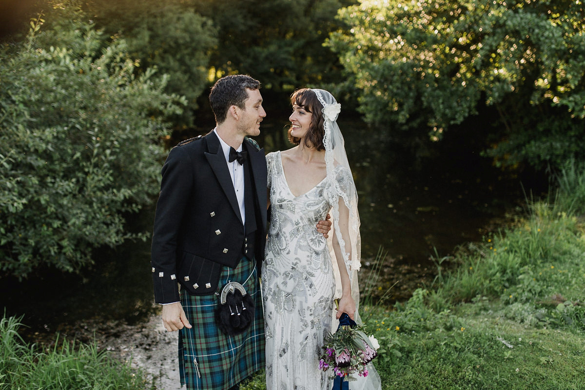 Bride Imogen wore the 'Jayne' gown by Eliza Jane Howell, and a Juliet cap veil, for her Celtic handfasting wedding at a French cheateau. Photography by Lifestories Wedding Photography.