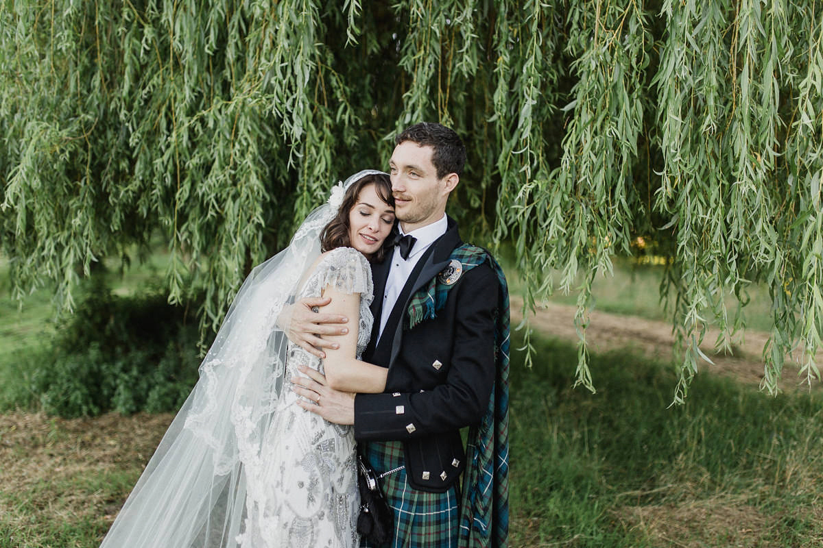 Bride Imogen wore the 'Jayne' gown by Eliza Jane Howell, and a Juliet cap veil, for her Celtic handfasting wedding at a French cheateau. Photography by Lifestories Wedding Photography.