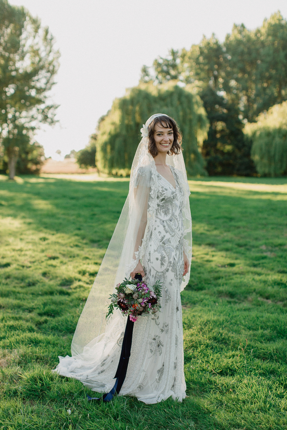 Bride Imogen wore the 'Jayne' gown by Eliza Jane Howell, and a Juliet cap veil, for her Celtic handfasting wedding at a French cheateau. Photography by Lifestories Wedding Photography.