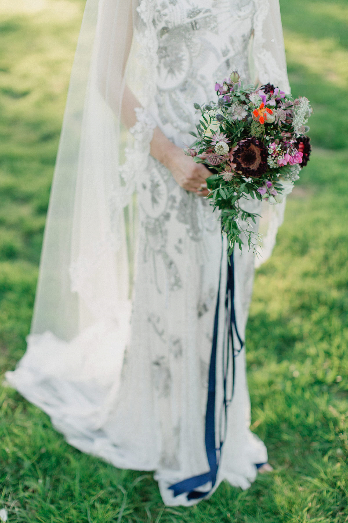 Bride Imogen wore the 'Jayne' gown by Eliza Jane Howell, and a Juliet cap veil, for her Celtic handfasting wedding at a French cheateau. Photography by Lifestories Wedding Photography.