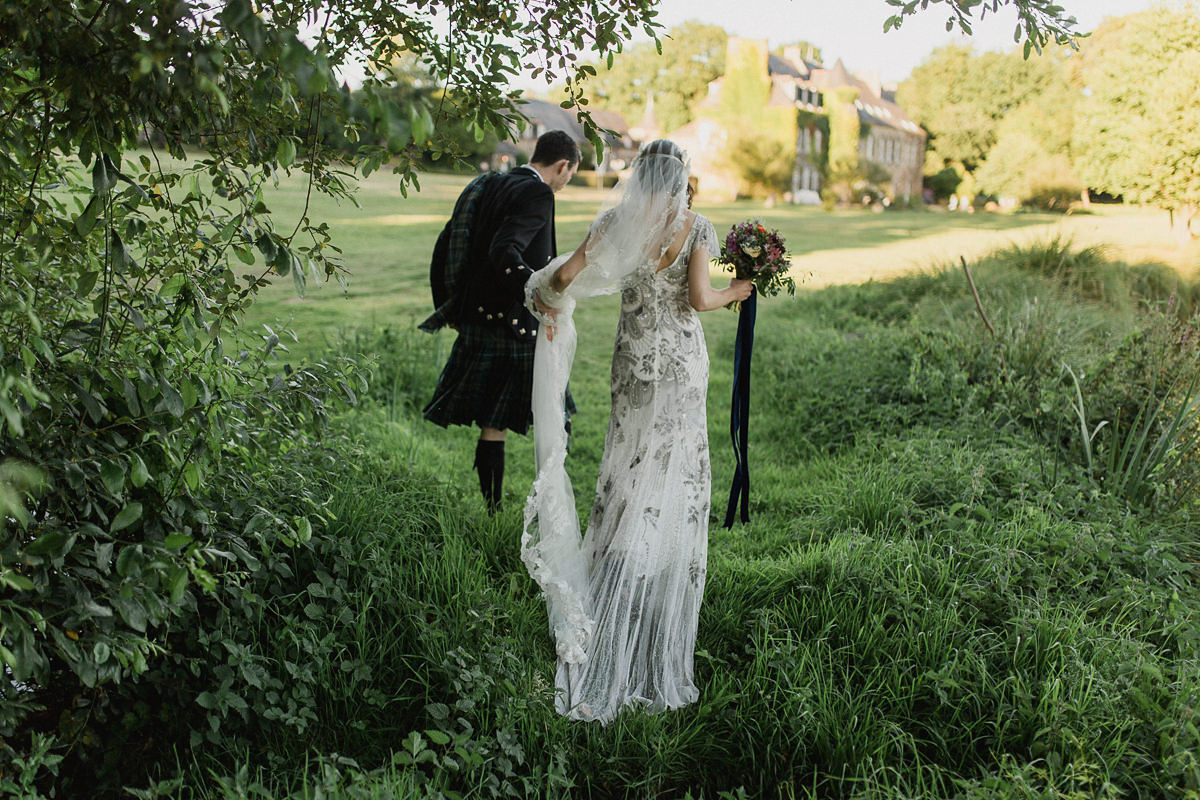 Bride Imogen wore the 'Jayne' gown by Eliza Jane Howell, and a Juliet cap veil, for her Celtic handfasting wedding at a French cheateau. Photography by Lifestories Wedding Photography.