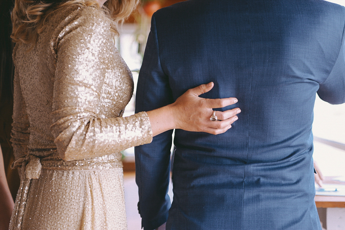 Amelia wore a gold sequin wedding dress for her relaxed, homespun and handmade wedding by the seaside in New Zealand. Photography by Sarah Burton.