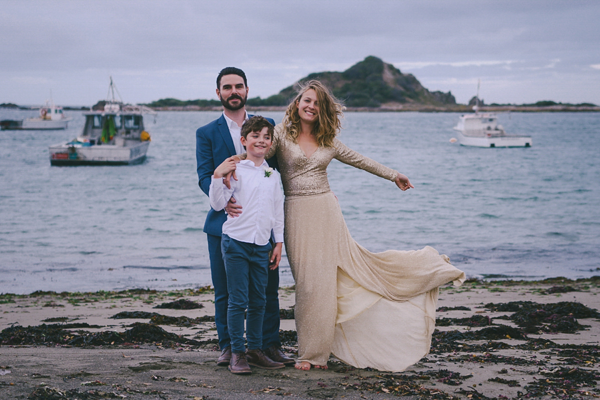 Amelia wore a gold sequin wedding dress for her relaxed, homespun and handmade wedding by the seaside in New Zealand. Photography by Sarah Burton.
