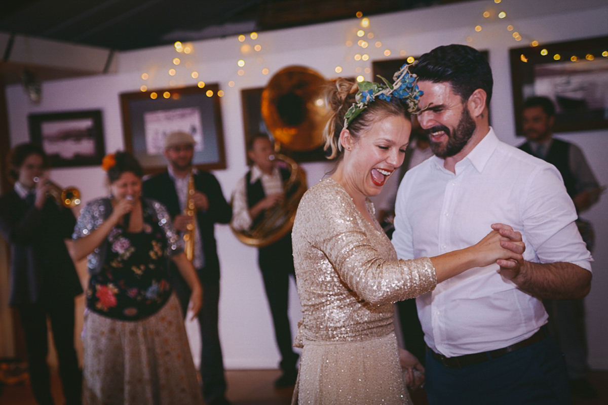 Amelia wore a gold sequin wedding dress for her relaxed, homespun and handmade wedding by the seaside in New Zealand. Photography by Sarah Burton.