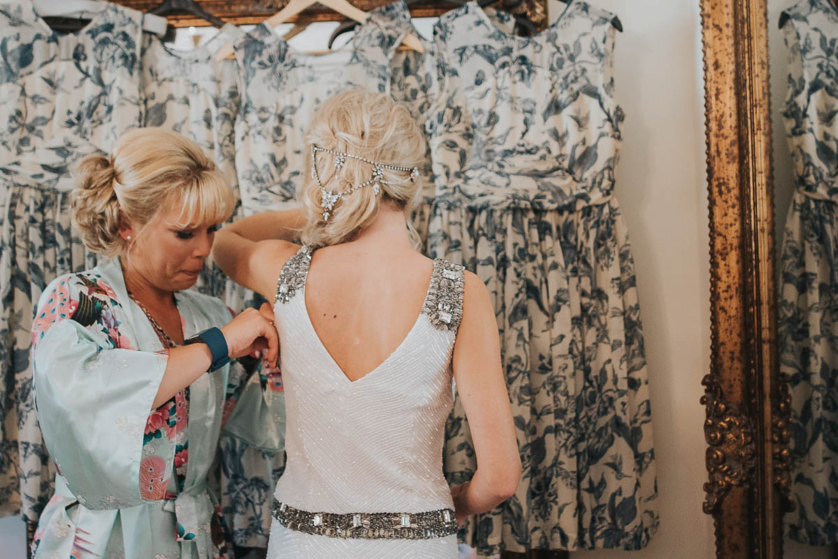 Bride Faye wears an 1930's inspired drop waist glamorous dress by Eliza jane Howell for her effortlessly elegant summer garden party wedding.