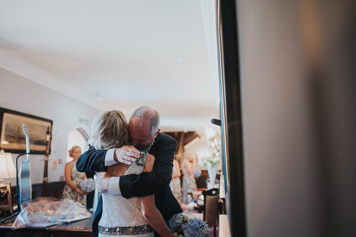 Bride Faye wears an 1930's inspired drop waist glamorous dress by Eliza jane Howell for her effortlessly elegant summer garden party wedding.