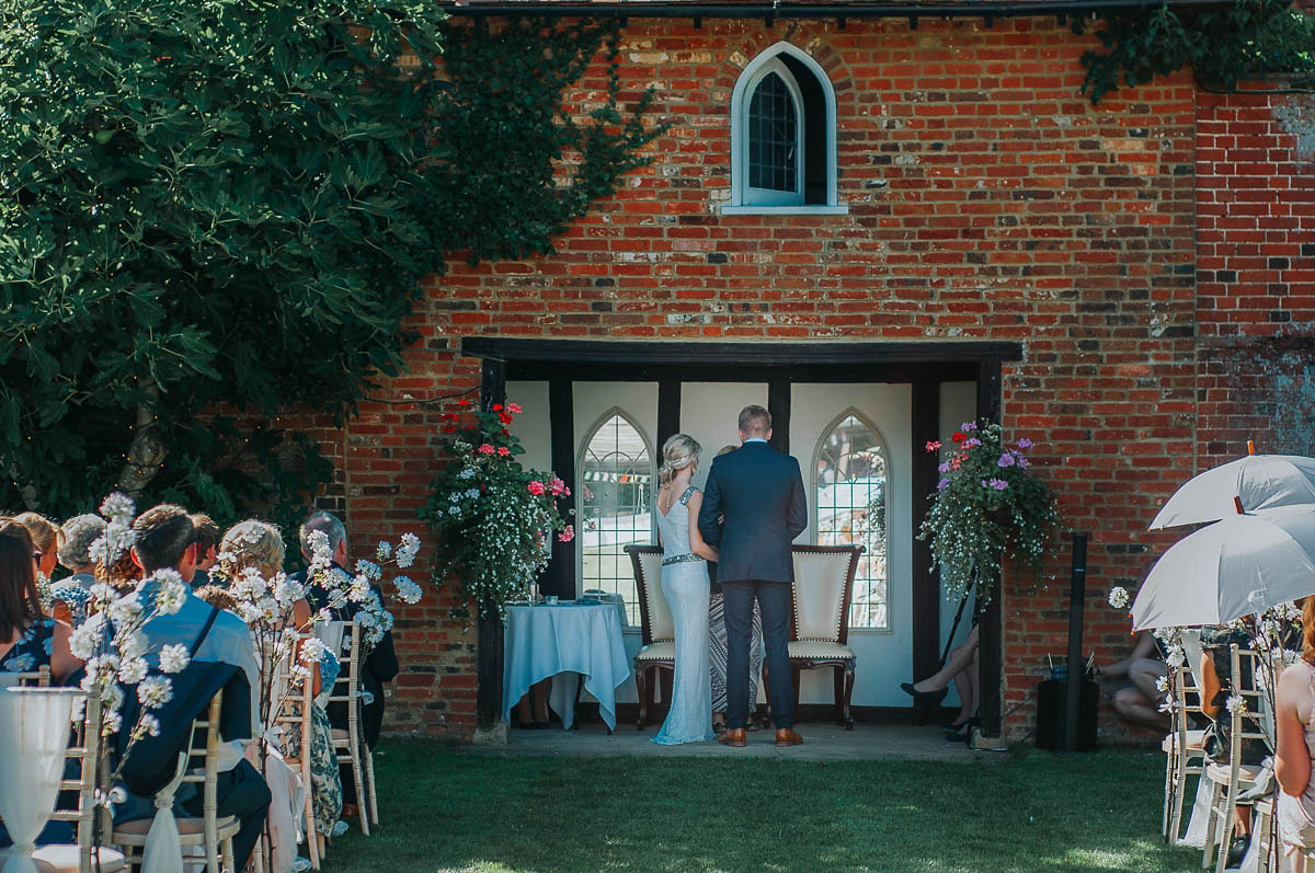 Bride Faye wears an 1930's inspired drop waist glamorous dress by Eliza jane Howell for her effortlessly elegant summer garden party wedding.