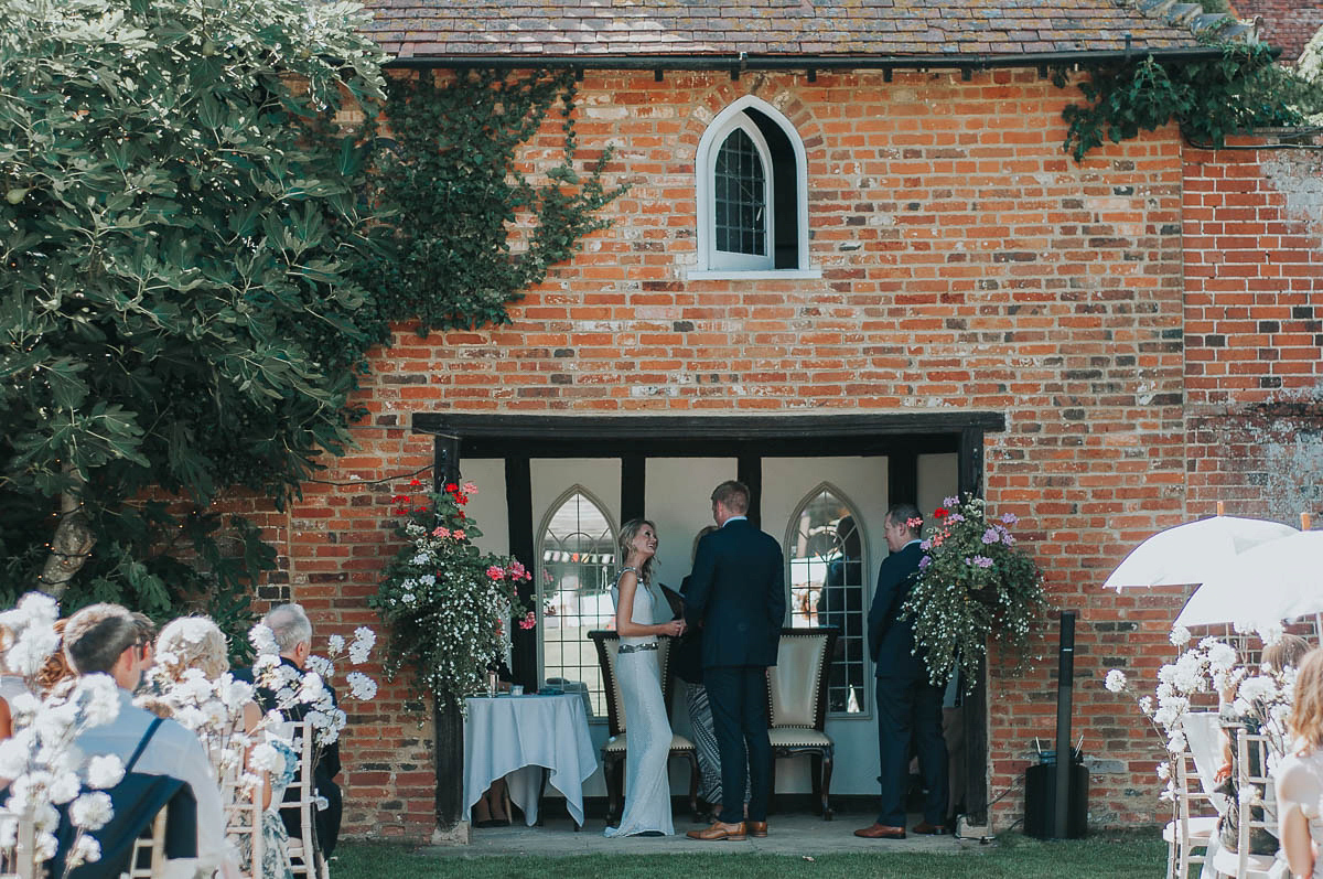 Bride Faye wears an 1930's inspired drop waist glamorous dress by Eliza jane Howell for her effortlessly elegant summer garden party wedding.