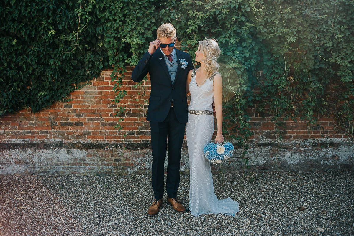 Bride Faye wears an 1930's inspired drop waist glamorous dress by Eliza jane Howell for her effortlessly elegant summer garden party wedding.