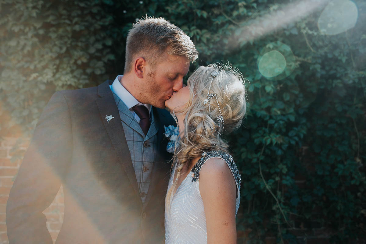 Bride Faye wears an 1930's inspired drop waist glamorous dress by Eliza jane Howell for her effortlessly elegant summer garden party wedding.