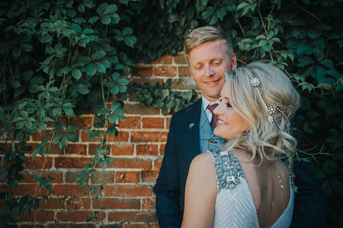 Bride Faye wears an 1930's inspired drop waist glamorous dress by Eliza jane Howell for her effortlessly elegant summer garden party wedding.