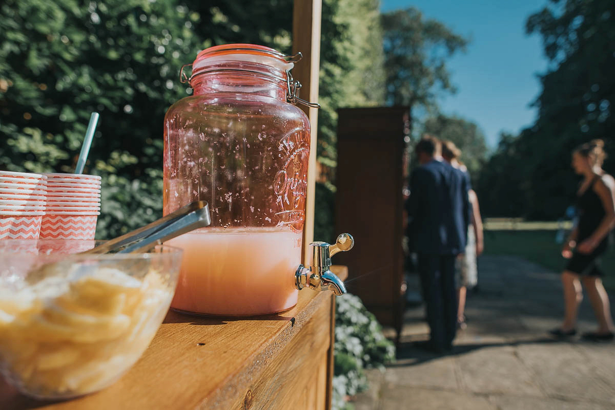 Bride Faye wears an 1930's inspired drop waist glamorous dress by Eliza jane Howell for her effortlessly elegant summer garden party wedding.