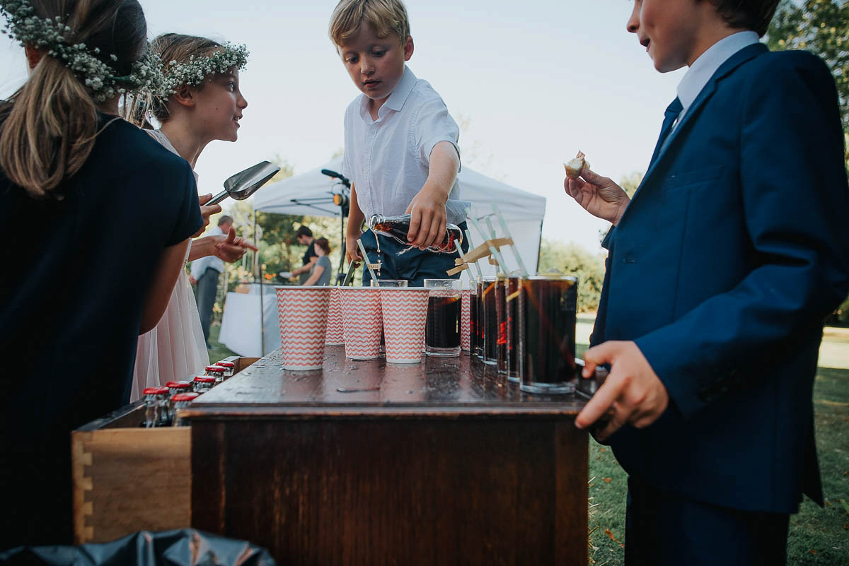 Bride Faye wears an 1930's inspired drop waist glamorous dress by Eliza jane Howell for her effortlessly elegant summer garden party wedding.