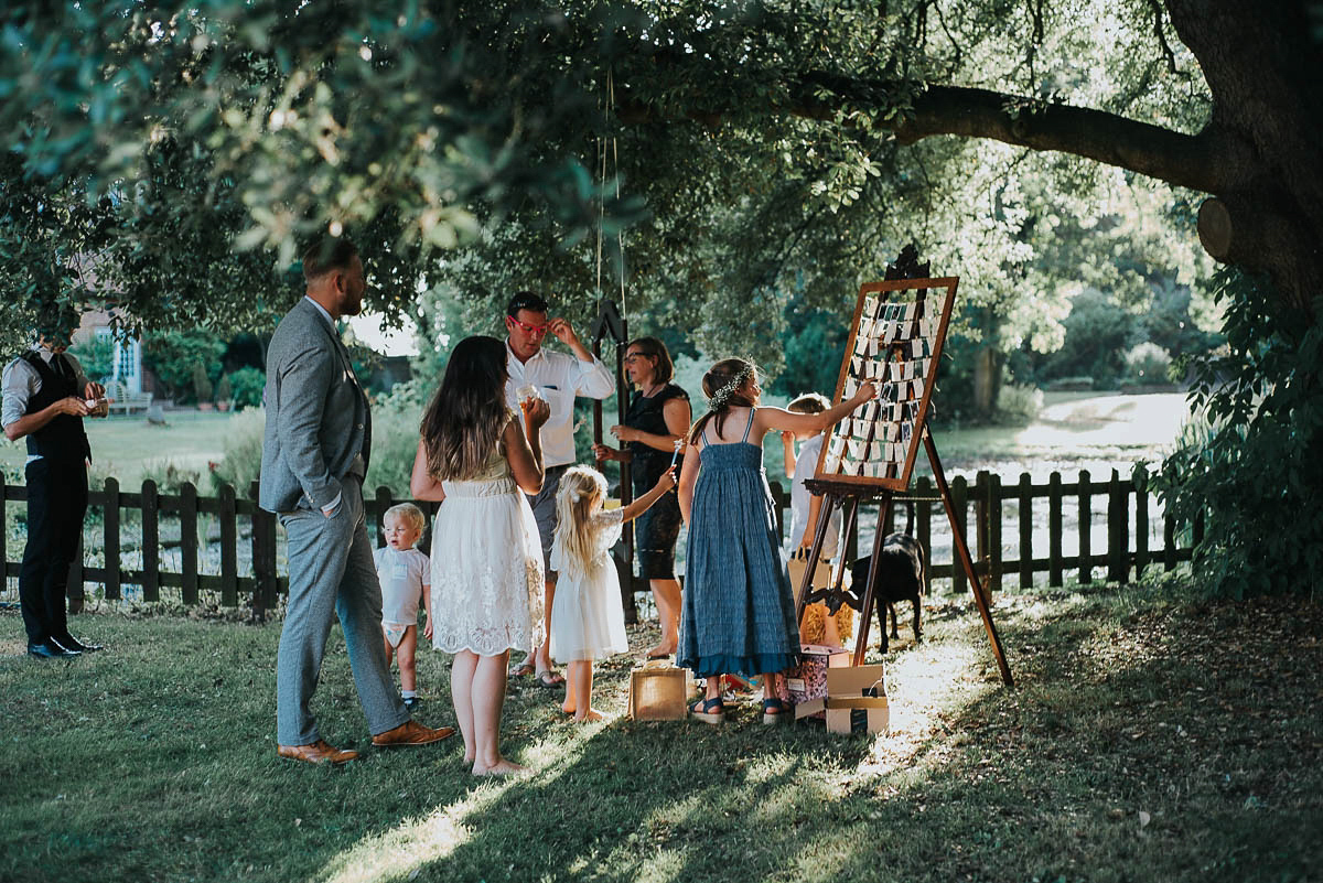 Bride Faye wears an 1930's inspired drop waist glamorous dress by Eliza jane Howell for her effortlessly elegant summer garden party wedding.