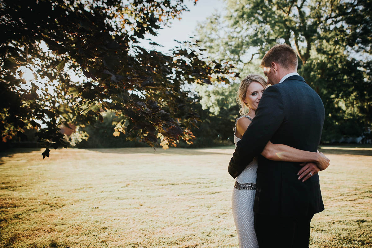 Bride Faye wears an 1930's inspired drop waist glamorous dress by Eliza jane Howell for her effortlessly elegant summer garden party wedding.