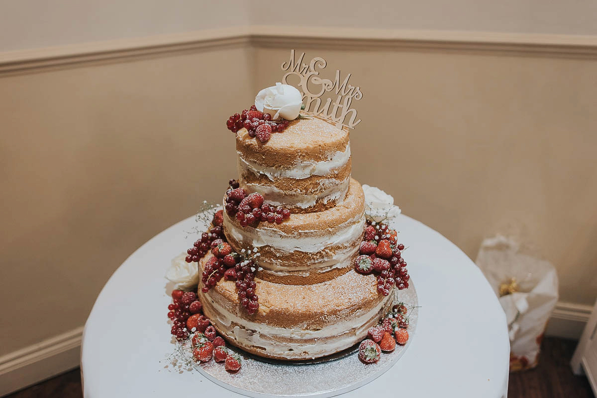 Bride Faye wears an 1930's inspired drop waist glamorous dress by Eliza jane Howell for her effortlessly elegant summer garden party wedding.