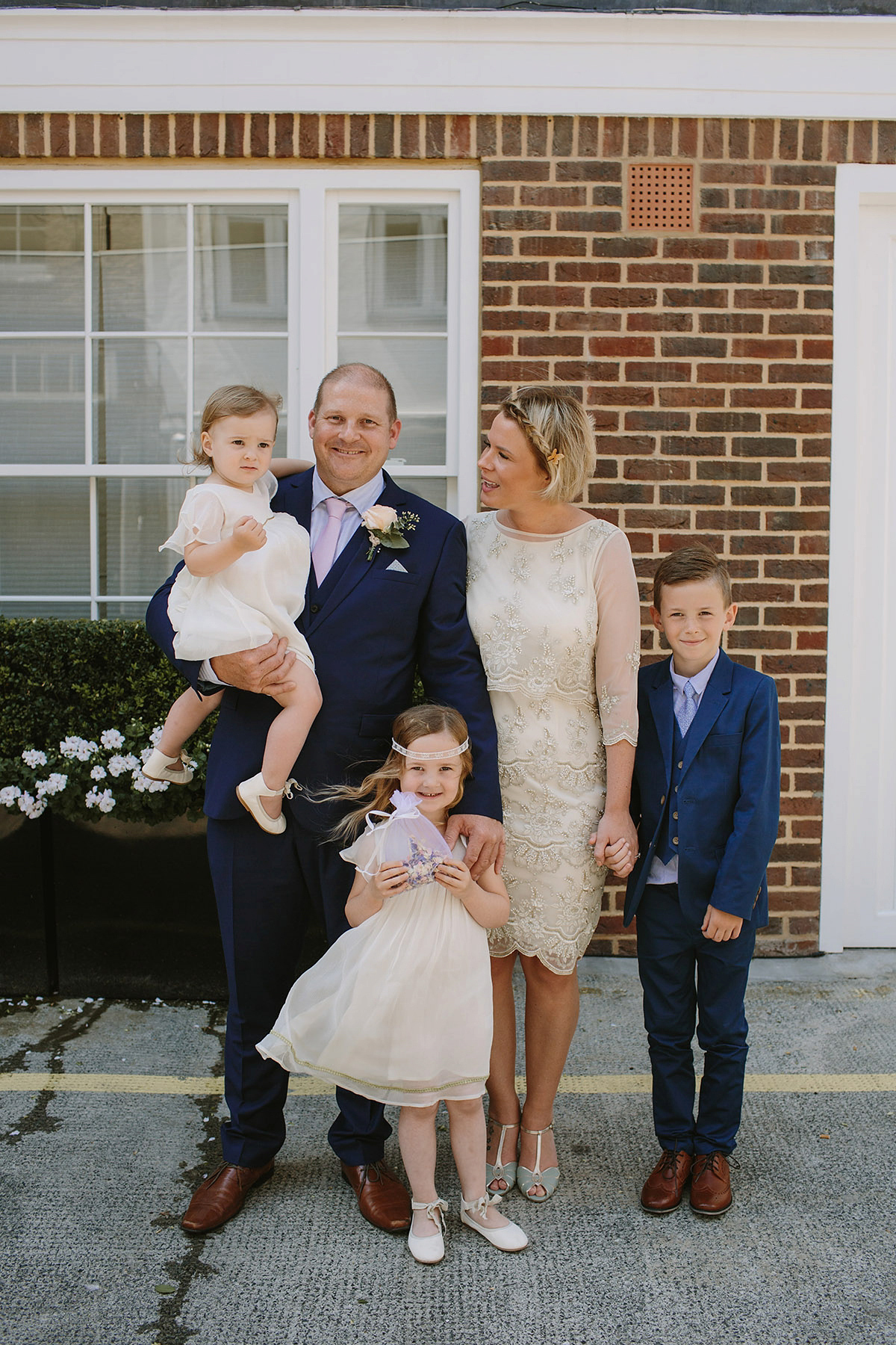 Helaina wore a short, beaded dress from Monsoon for her Westminster wedding. Photography by Emilie White. Helaina and Dan had a larger wedding celebration in France and we'll be sharing those images on Sunday 8th January 2017.