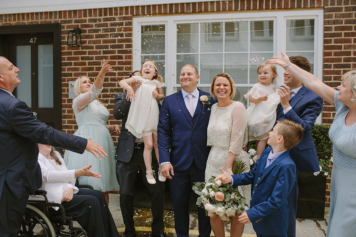 Helaina wore a short, beaded dress from Monsoon for her Westminster wedding. Photography by Emilie White. Helaina and Dan had a larger wedding celebration in France and we'll be sharing those images on Sunday 8th January 2017.