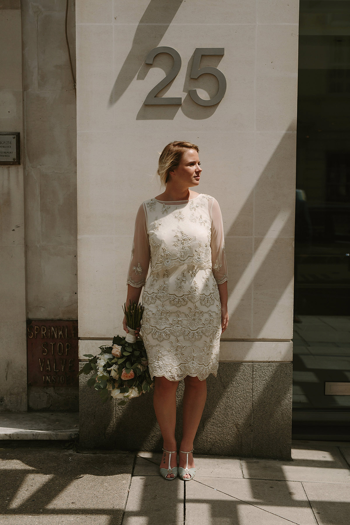 Helaina wore a short, beaded dress from Monsoon for her Westminster wedding. Photography by Emilie White. Helaina and Dan had a larger wedding celebration in France and we'll be sharing those images on Sunday 8th January 2017.