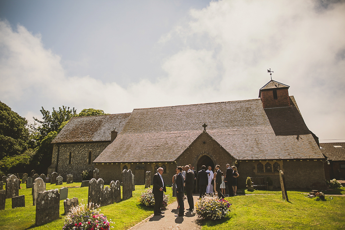 Ashleigh wore an elegant Charlie Brear gown for her sunshine and sunflower filled wedding. A Mariachi band entertained guests at the reception. Bridesmaids wore ASOS. Photography by The Springles.