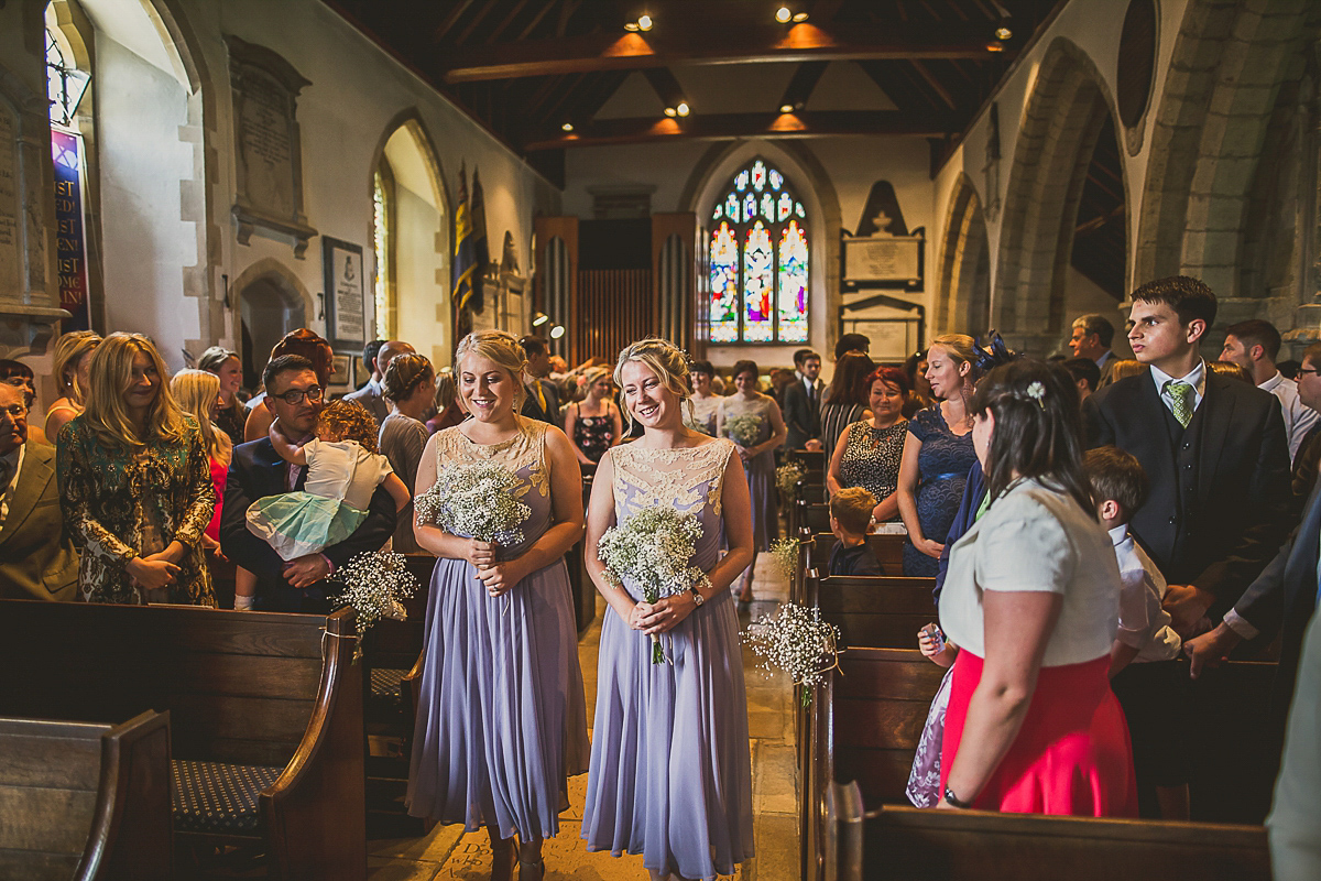 Ashleigh wore an elegant Charlie Brear gown for her sunshine and sunflower filled wedding. A Mariachi band entertained guests at the reception. Bridesmaids wore ASOS. Photography by The Springles.