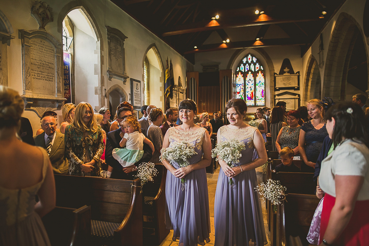 Ashleigh wore an elegant Charlie Brear gown for her sunshine and sunflower filled wedding. A Mariachi band entertained guests at the reception. Bridesmaids wore ASOS. Photography by The Springles.