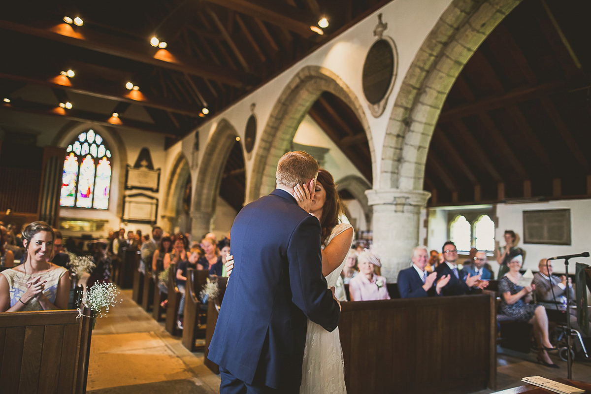 Ashleigh wore an elegant Charlie Brear gown for her sunshine and sunflower filled wedding. A Mariachi band entertained guests at the reception. Bridesmaids wore ASOS. Photography by The Springles.