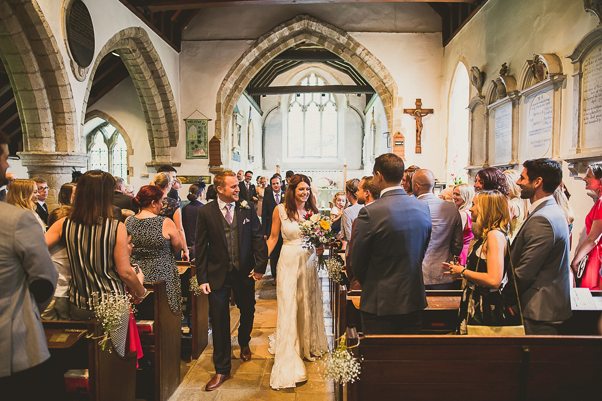 Ashleigh wore an elegant Charlie Brear gown for her sunshine and sunflower filled wedding. A Mariachi band entertained guests at the reception. Bridesmaids wore ASOS. Photography by The Springles.