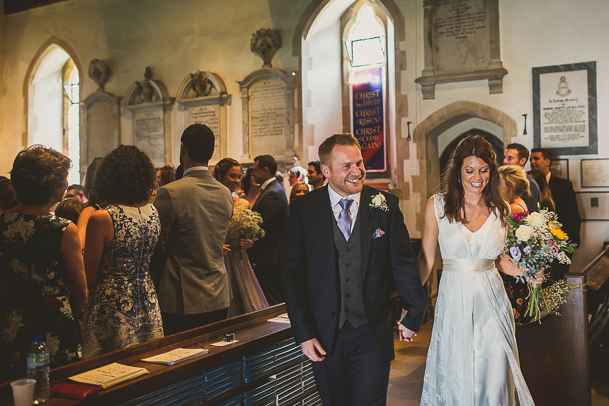 Ashleigh wore an elegant Charlie Brear gown for her sunshine and sunflower filled wedding. A Mariachi band entertained guests at the reception. Bridesmaids wore ASOS. Photography by The Springles.