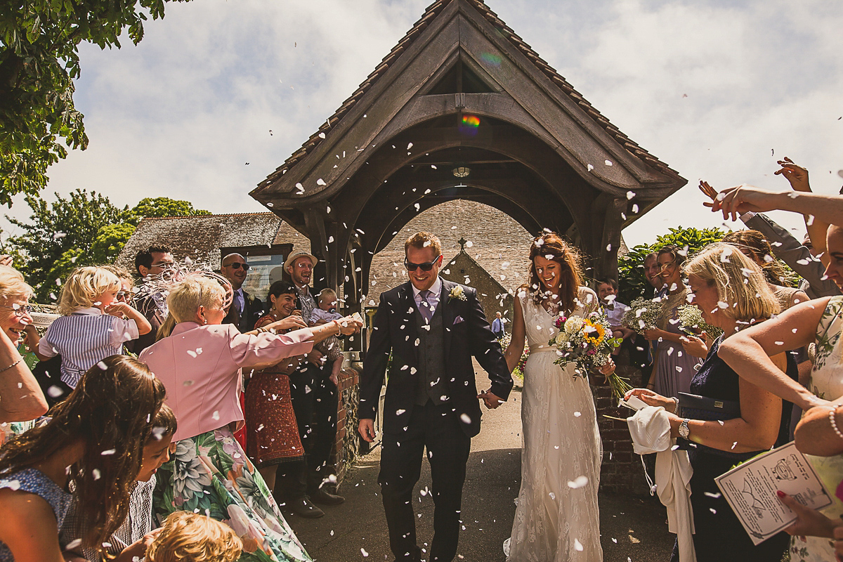 Ashleigh wore an elegant Charlie Brear gown for her sunshine and sunflower filled wedding. A Mariachi band entertained guests at the reception. Bridesmaids wore ASOS. Photography by The Springles.